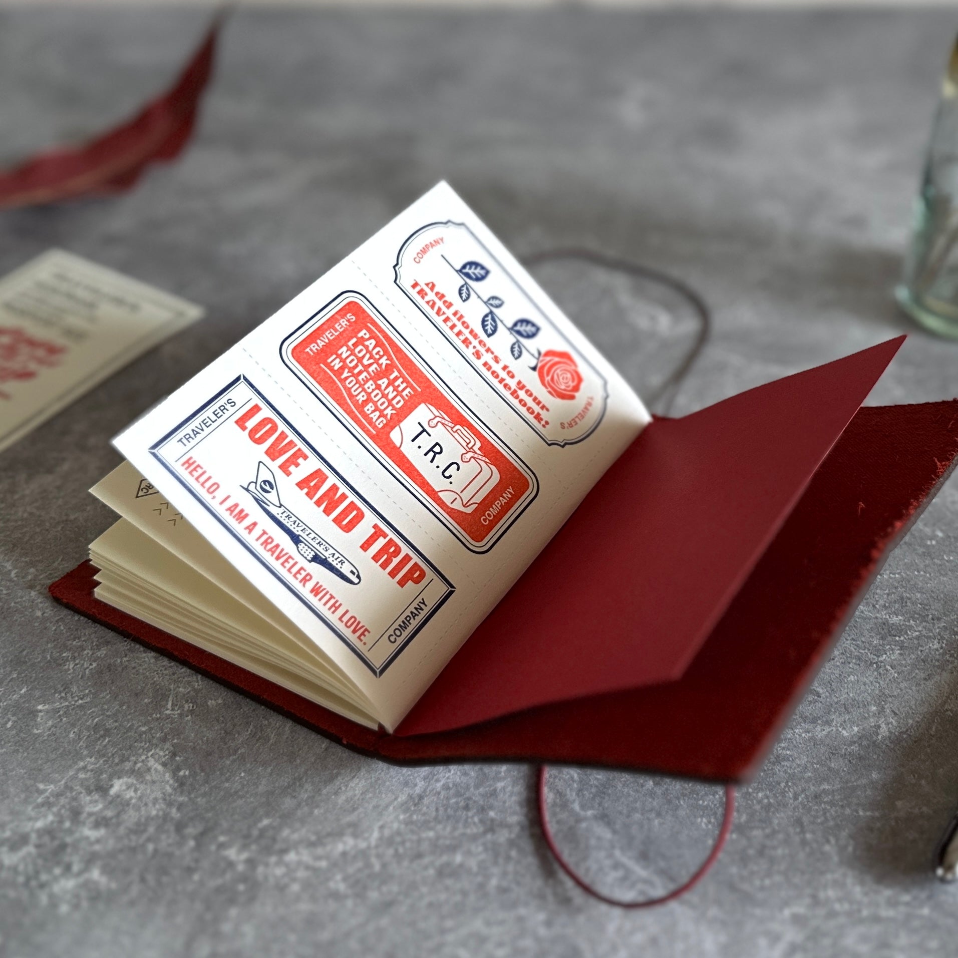 Bouquet of red roses held by a person against a plain background